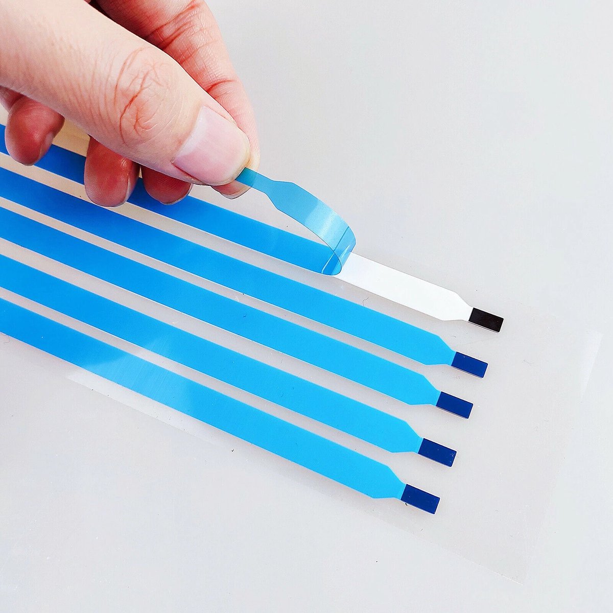 Adhesive strip removable for laptop screens that need to be glued